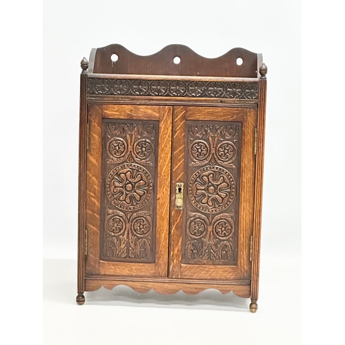 258 - A Late 19th Century tabletop/wall hanging oak smokers cabinet. With pipe and original humidor. 33x17... 