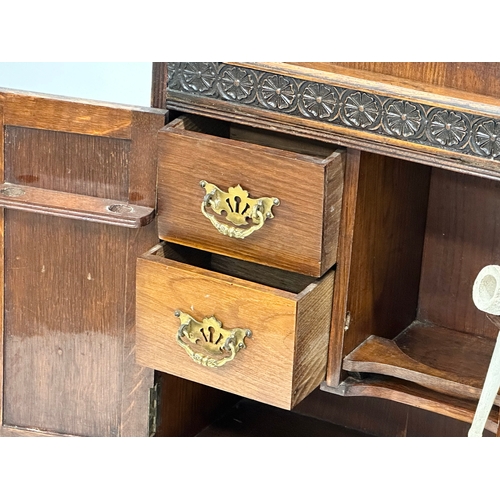 258 - A Late 19th Century tabletop/wall hanging oak smokers cabinet. With pipe and original humidor. 33x17... 