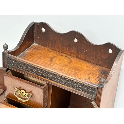 258 - A Late 19th Century tabletop/wall hanging oak smokers cabinet. With pipe and original humidor. 33x17... 