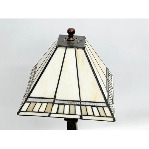 787 - A Tiffany style table lamp. 56cm