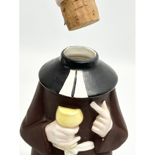 806 - Goebel Pottery. A 1950’s M.J.Hummel friar tuck decanter 29cm. Together with milk jugs and money bank... 