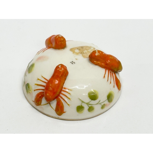 807 - 2 pieces of Early 20th Century German pottery. A pig and lobster pin dish 14cm. A pottery salt 7cm.