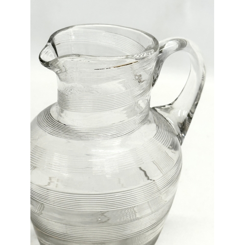 428 - A 19th Century Victorian wrythen glass jug. 12x16cm.