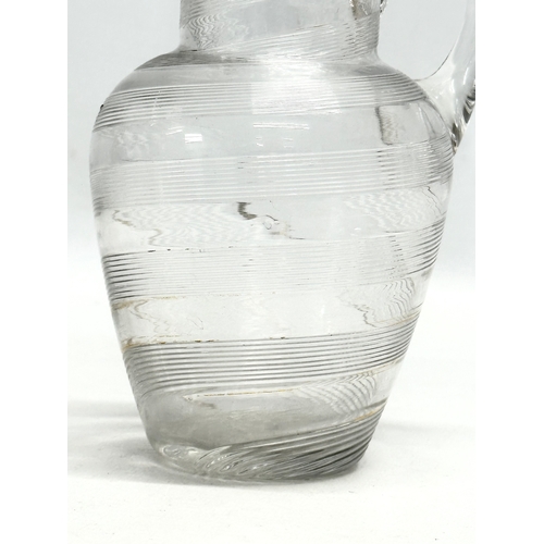 428 - A 19th Century Victorian wrythen glass jug. 12x16cm.