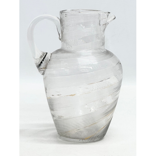 428 - A 19th Century Victorian wrythen glass jug. 12x16cm.