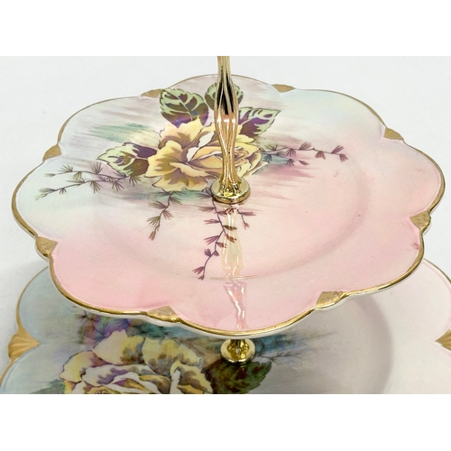 579 - A Mid 20th Century Royal Winton Lustre 2 tier cake stand. 25x26cm.