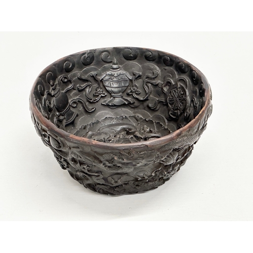 211 - A Chinese carved dragon and koi fish bowl. 20th Century. 15x8cm.