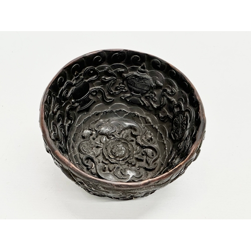 211 - A Chinese carved dragon and koi fish bowl. 20th Century. 15x8cm.