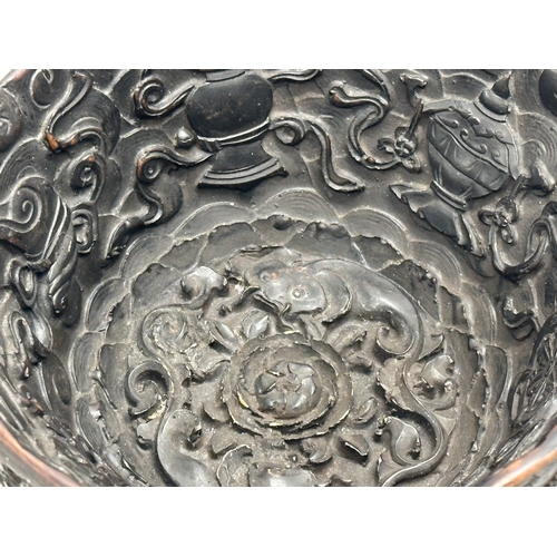 211 - A Chinese carved dragon and koi fish bowl. 20th Century. 15x8cm.