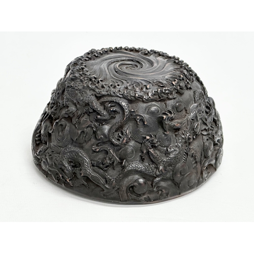 211 - A Chinese carved dragon and koi fish bowl. 20th Century. 15x8cm.