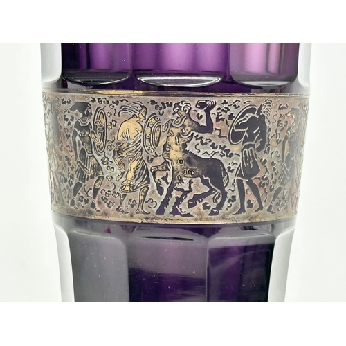 62 - Moser Karlsbad. A signed 1920’s Czech amethyst glass vase, with gilt panel depicting a mythical batt... 