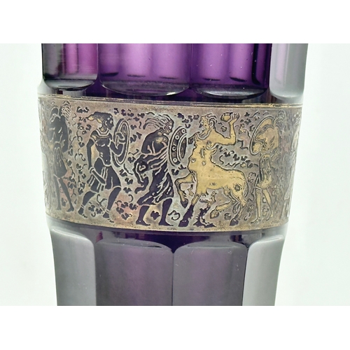 62 - Moser Karlsbad. A signed 1920’s Czech amethyst glass vase, with gilt panel depicting a mythical batt... 