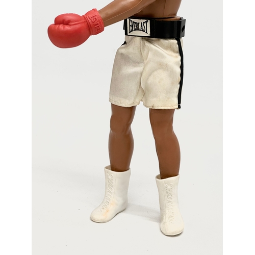 716 - A Denys Fisher Muhammad Ali figure with punch bag. 1976.