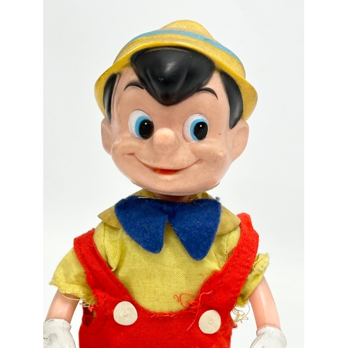 719 - A 1960’s R. Dakin & Company Pinocchio doll. 20cm