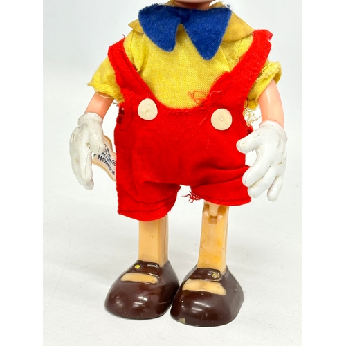 719 - A 1960’s R. Dakin & Company Pinocchio doll. 20cm