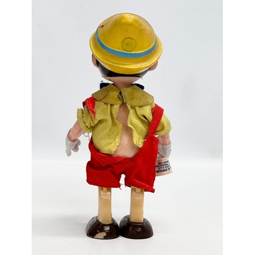 719 - A 1960’s R. Dakin & Company Pinocchio doll. 20cm