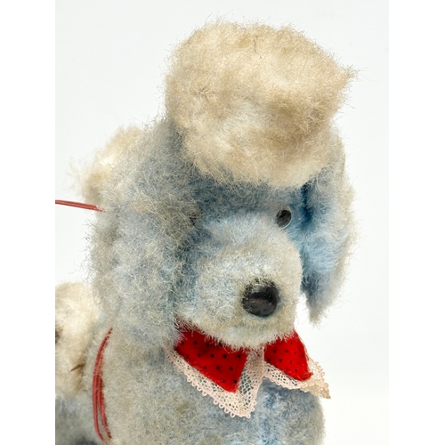 727 - A 1950’s/60’s Japanese battery operated poodle toy. Yonezawa, Japan.