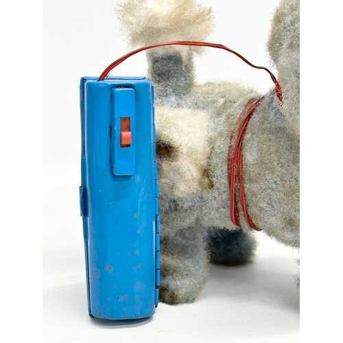 727 - A 1950’s/60’s Japanese battery operated poodle toy. Yonezawa, Japan.