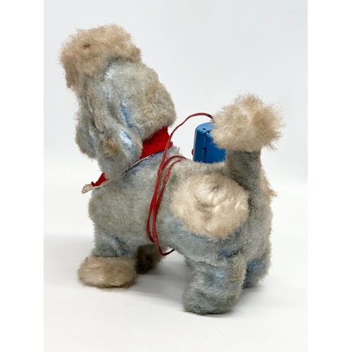 727 - A 1950’s/60’s Japanese battery operated poodle toy. Yonezawa, Japan.