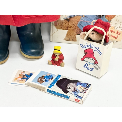 731 - Paddington Bear collectables. The Paddington Bear in red felt jacket, hat and Dunlop Wellington boot... 