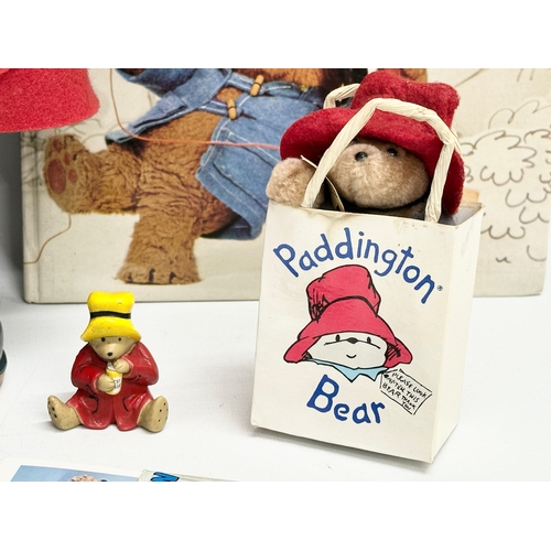 731 - Paddington Bear collectables. The Paddington Bear in red felt jacket, hat and Dunlop Wellington boot... 