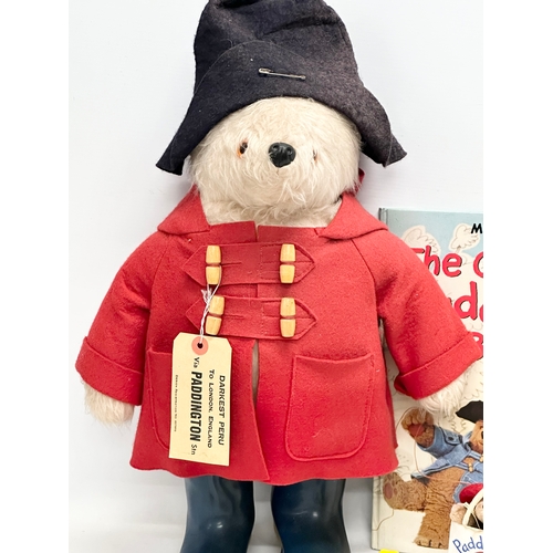 731 - Paddington Bear collectables. The Paddington Bear in red felt jacket, hat and Dunlop Wellington boot... 