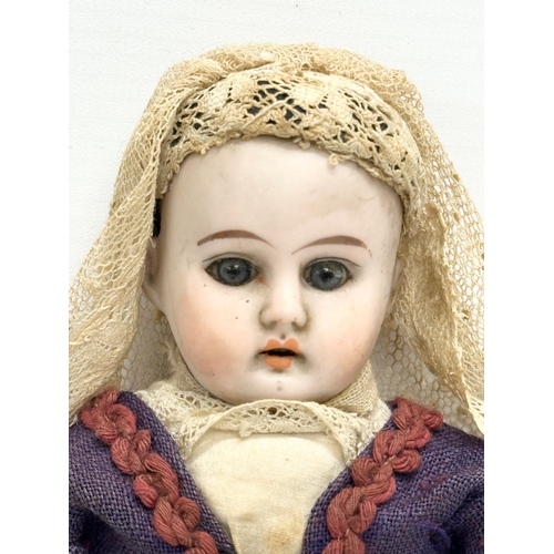 745 - 2 Early 20th Century bisque dolls. 1900-1910. 26cm