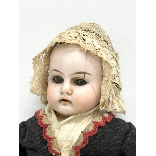 745 - 2 Early 20th Century bisque dolls. 1900-1910. 26cm