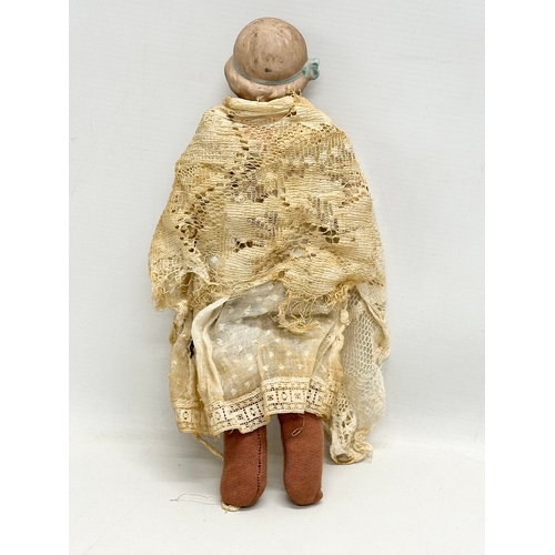 748 - Heubach. An Early 20th Century German bisque doll by Heubach. 31cm