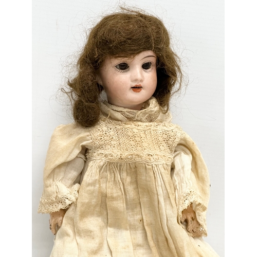 749 - Recknagel. An Early 20th Century German bisque doll by Recknagel. 1900-1915.