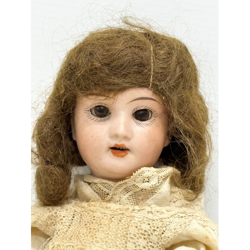 749 - Recknagel. An Early 20th Century German bisque doll by Recknagel. 1900-1915.