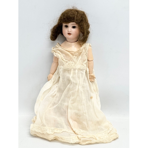 749 - Recknagel. An Early 20th Century German bisque doll by Recknagel. 1900-1915.