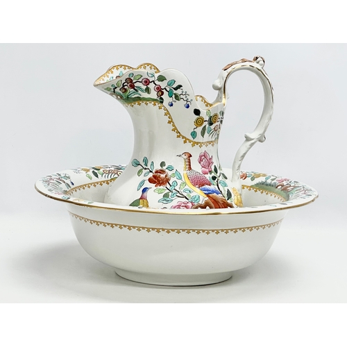 49 - Waring & Gillow. A large Late 19th/Early 20th Century wash bowl and jug by Copeland Spode for Waring... 