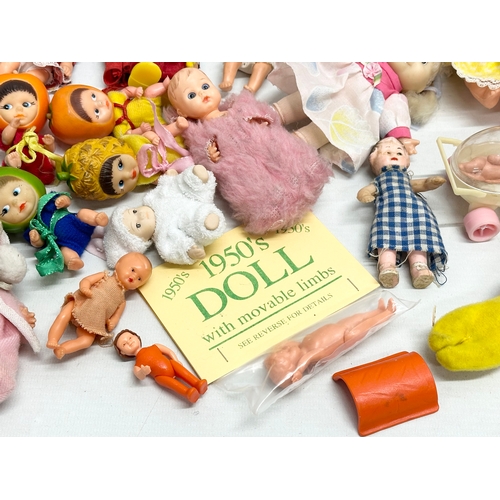 762 - A collection of 1960’s/70’s small and miniature dolls.