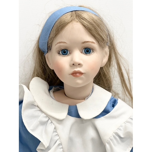 766 - A rare 1995 SCS/MDA Alice in Wonderland porcelain doll. Marked M. Ratcliffe. 62cm