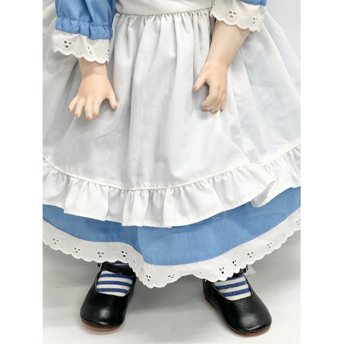 766 - A rare 1995 SCS/MDA Alice in Wonderland porcelain doll. Marked M. Ratcliffe. 62cm