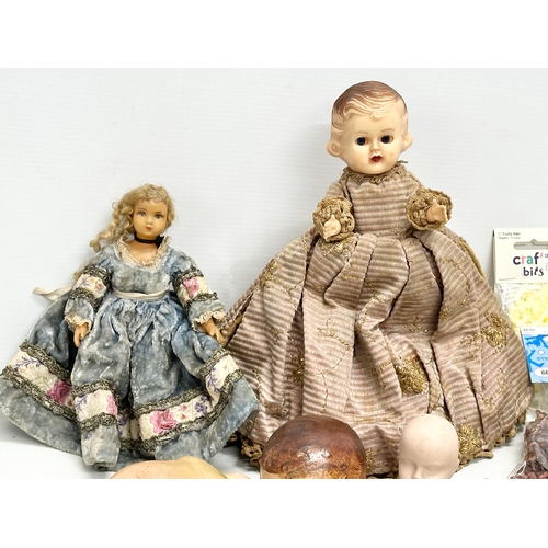 777 - A collection of Early and Mid 20th Century dolls and parts.