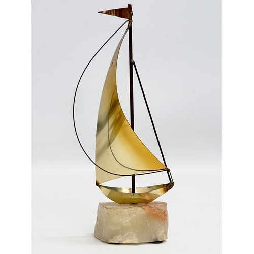 804 - John & Don Demott. 2 signed brass and onyx yachts. 24cm. 23cm.