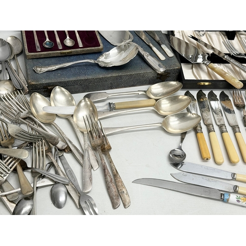 827 - A large quantity of silver plated cutlery.