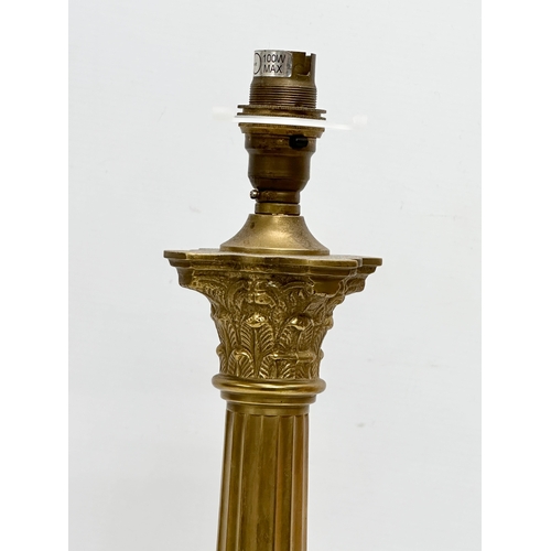 431 - A tall brass table lamp with Corinthian style column. By Laura Ashley. 49cm