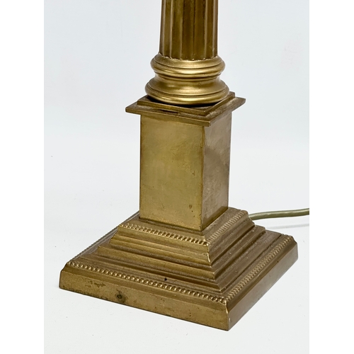 431 - A tall brass table lamp with Corinthian style column. By Laura Ashley. 49cm