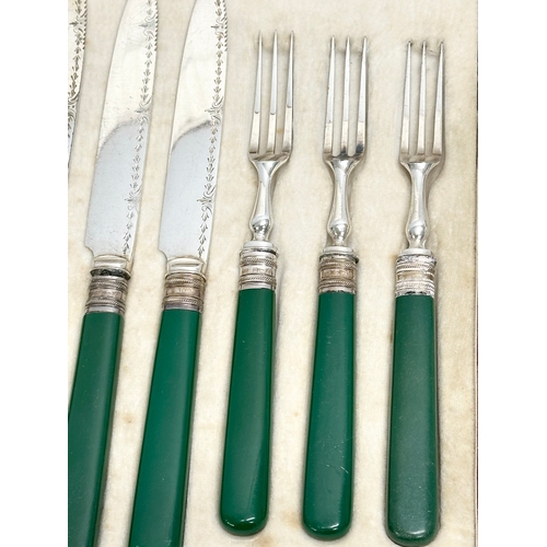 660 - George Howson. A set of Late 19th Century silver mounted fish forks and knives, in case. Retailed by... 