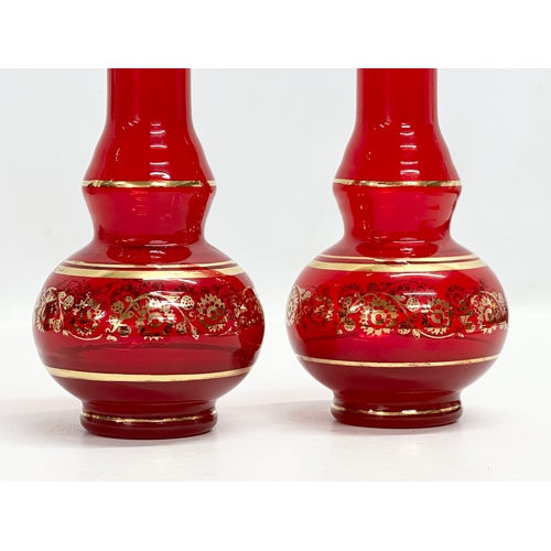 832 - A pair of Mid 20th Century Venetian Murano ruby glass vases. 25cm