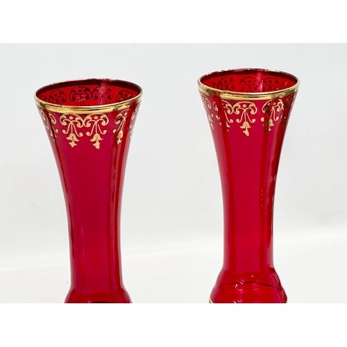 832 - A pair of Mid 20th Century Venetian Murano ruby glass vases. 25cm