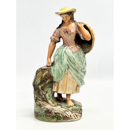 461 - A 19th Century Staffordshire Pottery figurine. 24cm