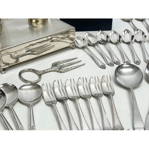 968 - A collection of silver plate and stainless steel. E.P and stainless cutlery. House of Marbles wine b... 