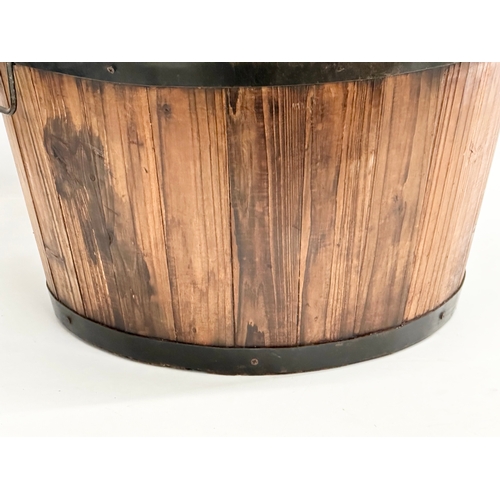 971 - A wooden barrel form planter. 46x32cm