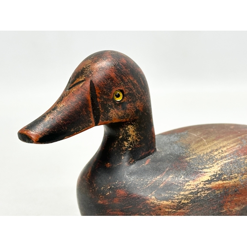 535B - A vintage wooden duck decoy with glass eyes. 18m