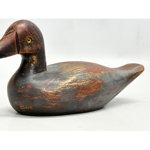 535B - A vintage wooden duck decoy with glass eyes. 18m