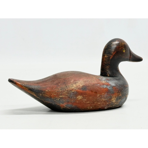 535B - A vintage wooden duck decoy with glass eyes. 18m